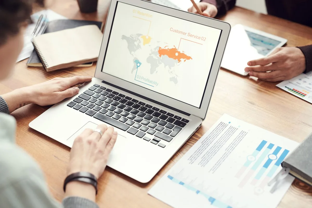Reviewing analytics reports around a table