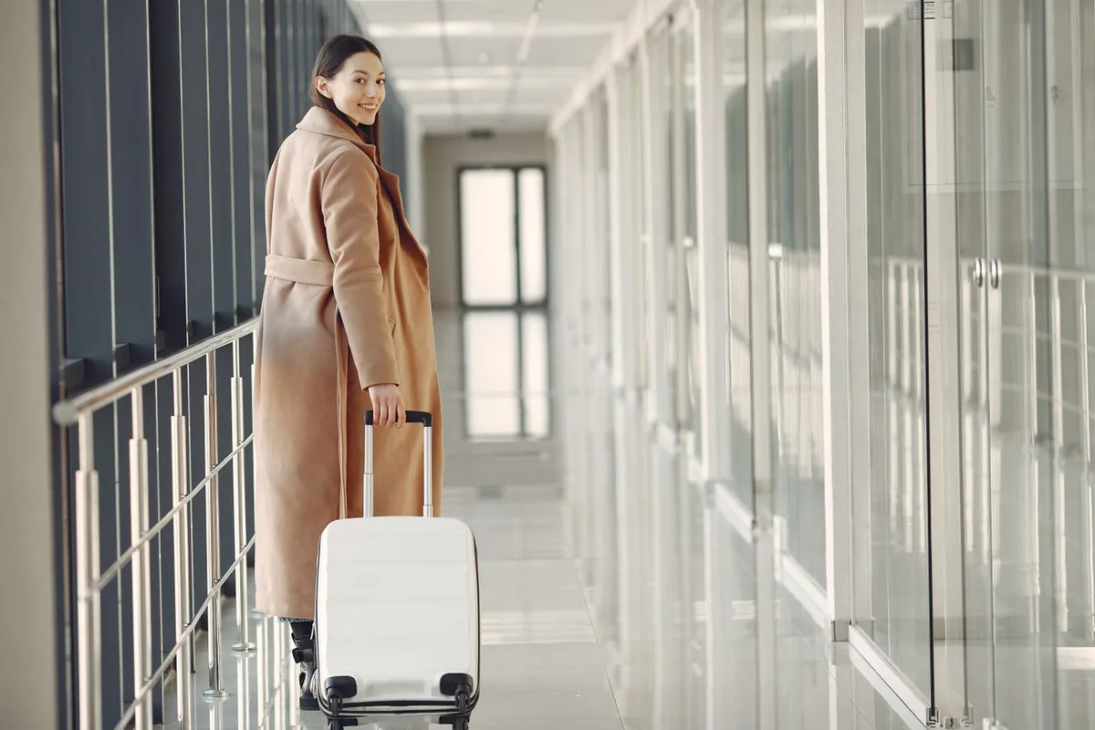 A newcomer arriving with luggage
